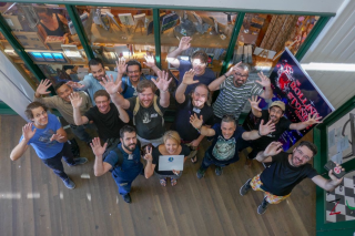 Attendees of DrupalCamp Byron Bay wave to the camera